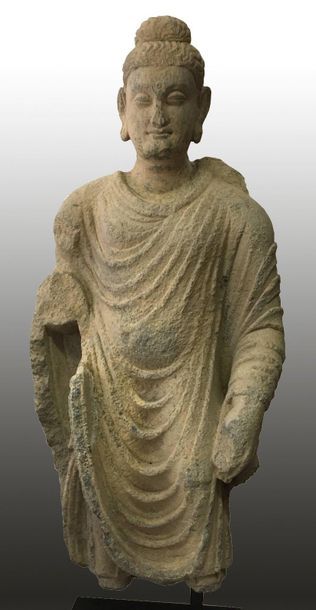 null Large body of standing Buddha, with his hair in fine curls, the skull surmounted...