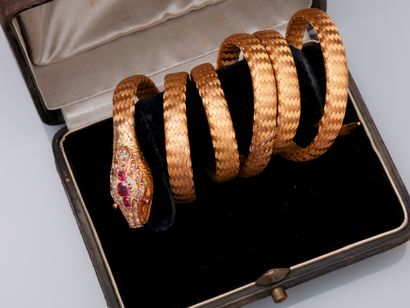 null Rare coiled snake bracelet in 750°/00 (18K) yellow gold, with braided threads,...