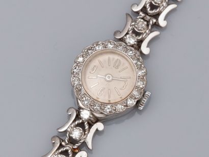 null Montre bracelet de dame en platine et or gris 750°/00 (18K), à boitier rond...