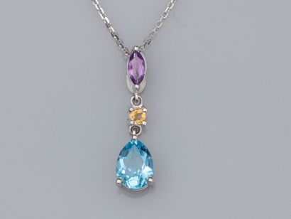 null 18K white gold chain and 18K white gold pendant set with a pear cut blue topaz,...