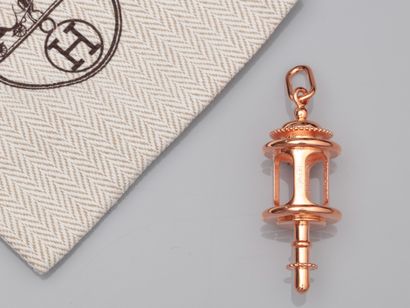null HERMES Charm pendant copper carriage lantern. Signed . H: 5.5 cm. Clutch ba...