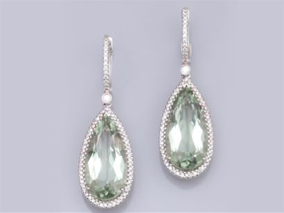 null Pair of 18K white gold earrings, each set with a pear cut prasiolite of approximately...
