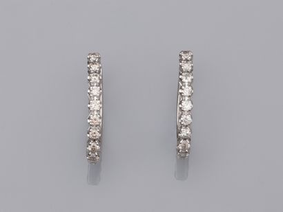 null Pair of creoles in 18K white gold 750°/00, each set with 9 brilliant-cut diamonds....