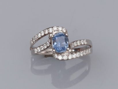 null 18K white gold tourbillon ring set with a 1.16 ct oval natural Ceylon sapphire...