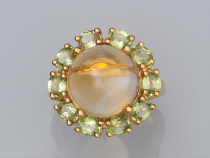 null Round gilt 925 gilt vermeil ring, set with a cabochon round citrine, surrounded...