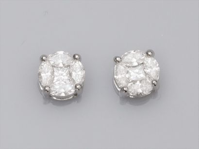 null Pair of 18K white gold round earrings, each set with a princess diamond surrounded...