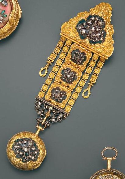PATRON Chatelaine et sa montre en or et argent composée de motifs de fleurs sertis...