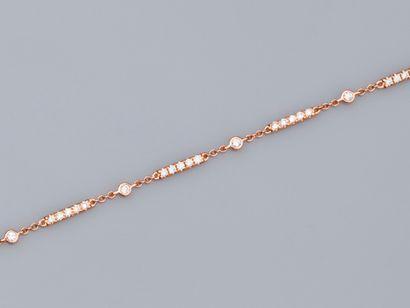 null Bracelet in 18K pink gold with lines of diamonds alternating with diamonds in...