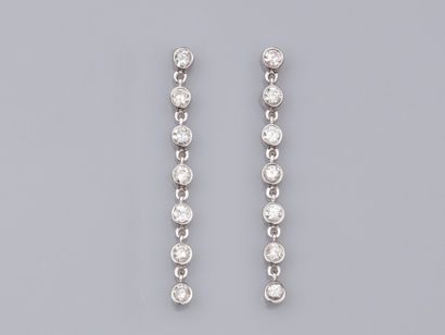 null Pair of earrings in 18K white gold, each set with 7 brilliant-cut diamonds....