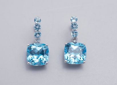 null Pair of white gold dormeuses set with cushion blue topazes, highlighted with...