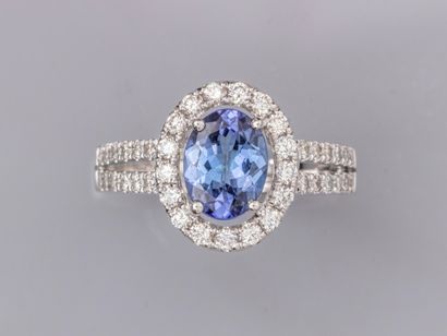 null Ring in 18K white gold, set with an oval tanzanite weighing approximately 1.30...