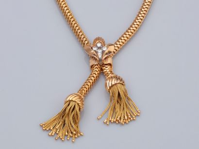 null Yellow gold negligee necklace with tubular mesh, decorated with two tassels...