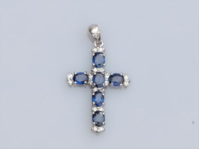 null Cross in 750°/00 white gold, set with oval sapphires (approx. 1.30 ct in all)...