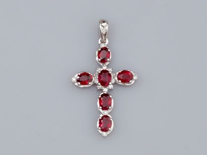 Cross in 18K white gold, set with oval rubies...