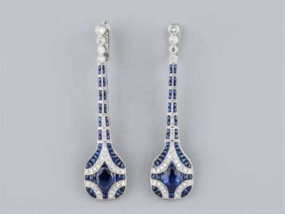 A pair of long earrings in platinum, set...