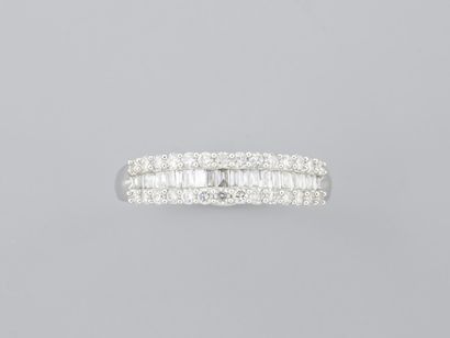 Ring in 18K white gold, set with a row of...