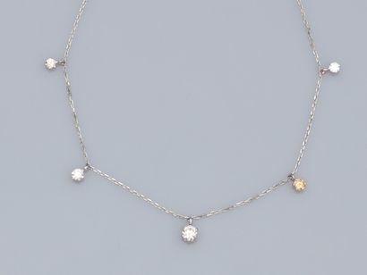  18K white gold drapery necklace; forçat link set with 5 brilliant-cut diamonds in...
