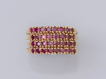 null Ring in yellow gold 585°/°°, formed by four rings set with small round rubies...