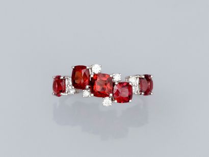 null Ring in 18K white gold, set with red cushion spinels (about 2 ct in all), and...