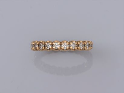 null Diamond wedding band in 18K yellow gold, set with brilliant-cut diamonds around...