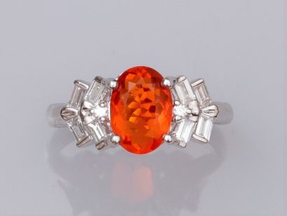null Ring in 18K white gold, set with a beautiful oval faceted fire opal weighing...