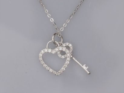 null Fine chain in 18K white gold with two openwork charms, key and heart, in 18K...