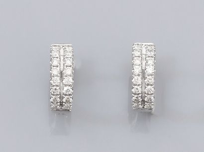 null Pair of round creoles in 18K white gold, set with two lines of brilliant-cut...