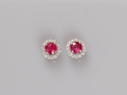 null Pair of round earrings in 18K white gold, set with small round rubies (approx....