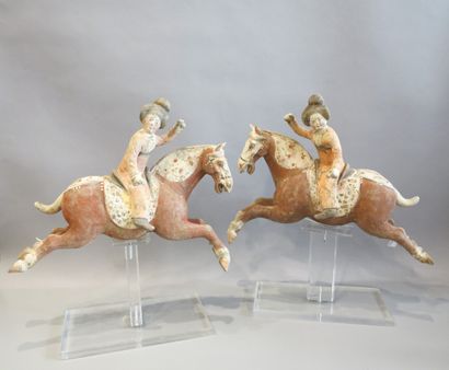 null Pair of polo players riding their mount in a jump. 

Terra cotta with engobe...