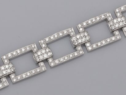 null Beau bracelet articulé en or gris 750°/00 , à maillons rectangulaires sertis...