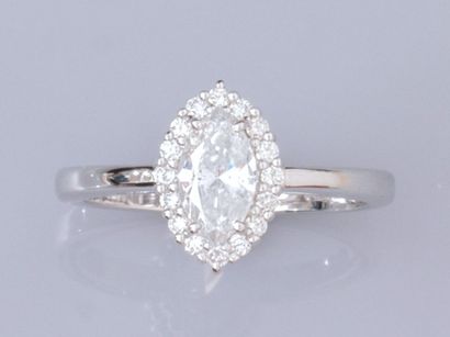 null Ring in 18K white gold, set with a 0.67-ct marquise diamond (weighed); surrounded...