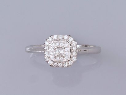 null Ring in 18K white gold, set with princess diamonds and brilliant-cut diamonds....