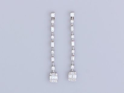 null Pair of long earrings in 18K white gold, set with baguette and brilliant-cut...