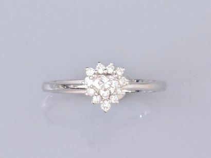 null Ring in 18K white gold, set with a small heart-cut diamond, surrounded by brilliant-cut...