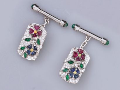 null Pair of cufflinks in 18K white gold, set with brilliant-cut diamonds, ruby sapphires...