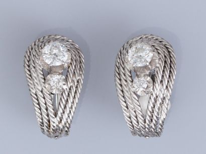 null Pair of twisted platinum earrings, each set with a 0.30 ct old cut diamond and...