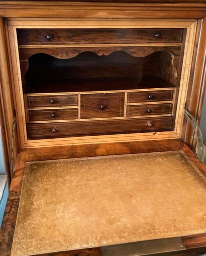 null Walnut secretary with flap opening to a drawer in high part, and three in low...