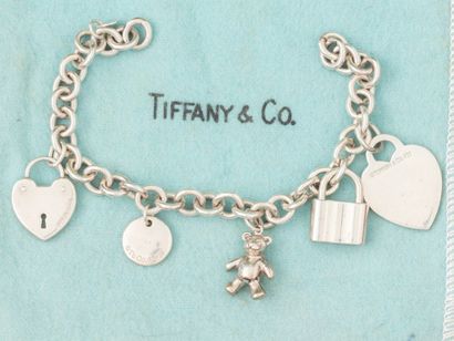 null TIFFANY & Co, bracelet en argent 925 ,maille forçat, à quatre breloques toutes...