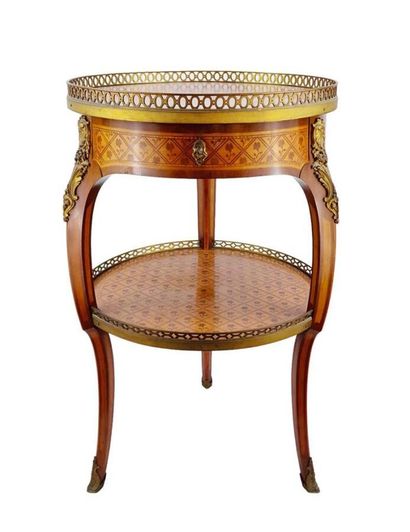 null Transitional marquetry pedestal table, standing on three curved legs, with inverted...