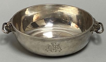 null Bowl of circular form with two holds with motives of lions' heads, in silver...