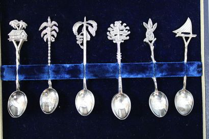null Set of eleven small spoons decorated with palm trees, pagodas and small rafts...
