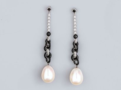 Pair of long earrings in 750°/°°(18K) white...
