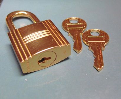 HERMES cadenas de sac à main en métal doré, deux clés