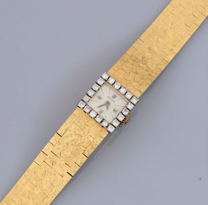null Montre bracelet de dame en or jaune 750°/00, à boitier carré serti d'un rang...