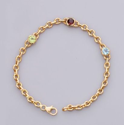   Bracelet en or jaune 750°/00, maille ronde orné de pierres fines rondes sertis...