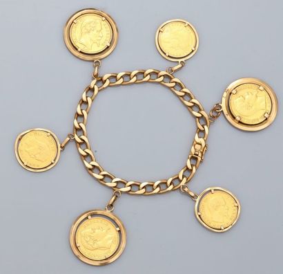   Bracelet en or jaune 750°/00 (18K), maille gourmette, orné de trois pièces de 10FRF...