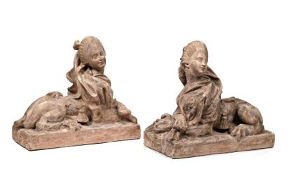 Pair of terracotta sphinxes, faces turned...