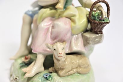  CAPODIMONTE 
Porcelain group representing a pastoral scene with a young couple playing...