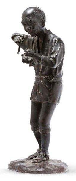 JAPON époque MEIJI (1868-1912) 
Okimono en bronze de patine brune, représentant un...