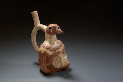  Vase avec tambour 
Vase étrier représentant un chamane assis. Il tient dans ses...